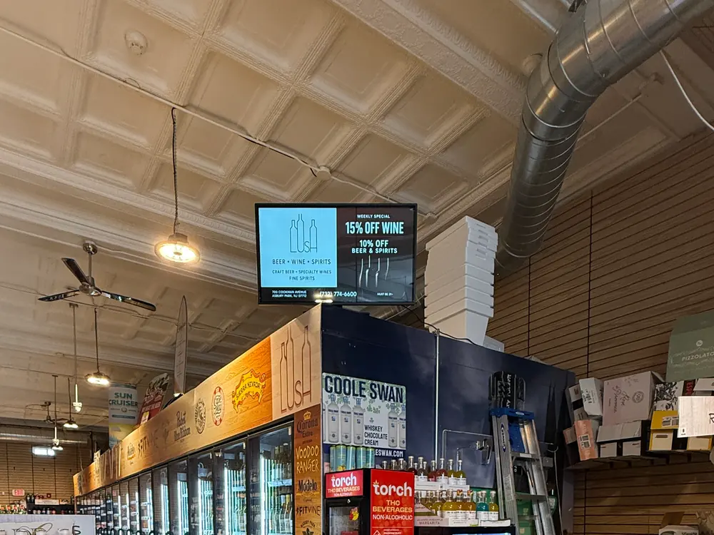 Digital Wave screen running a wine promotion in a local bottle shop