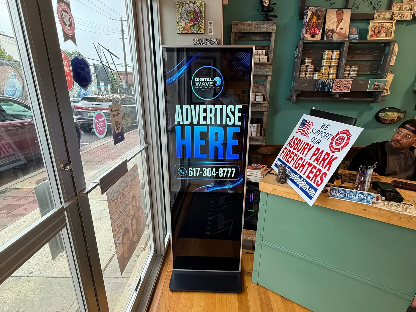 Digital Wave screen inside an Asbury Park barbershop