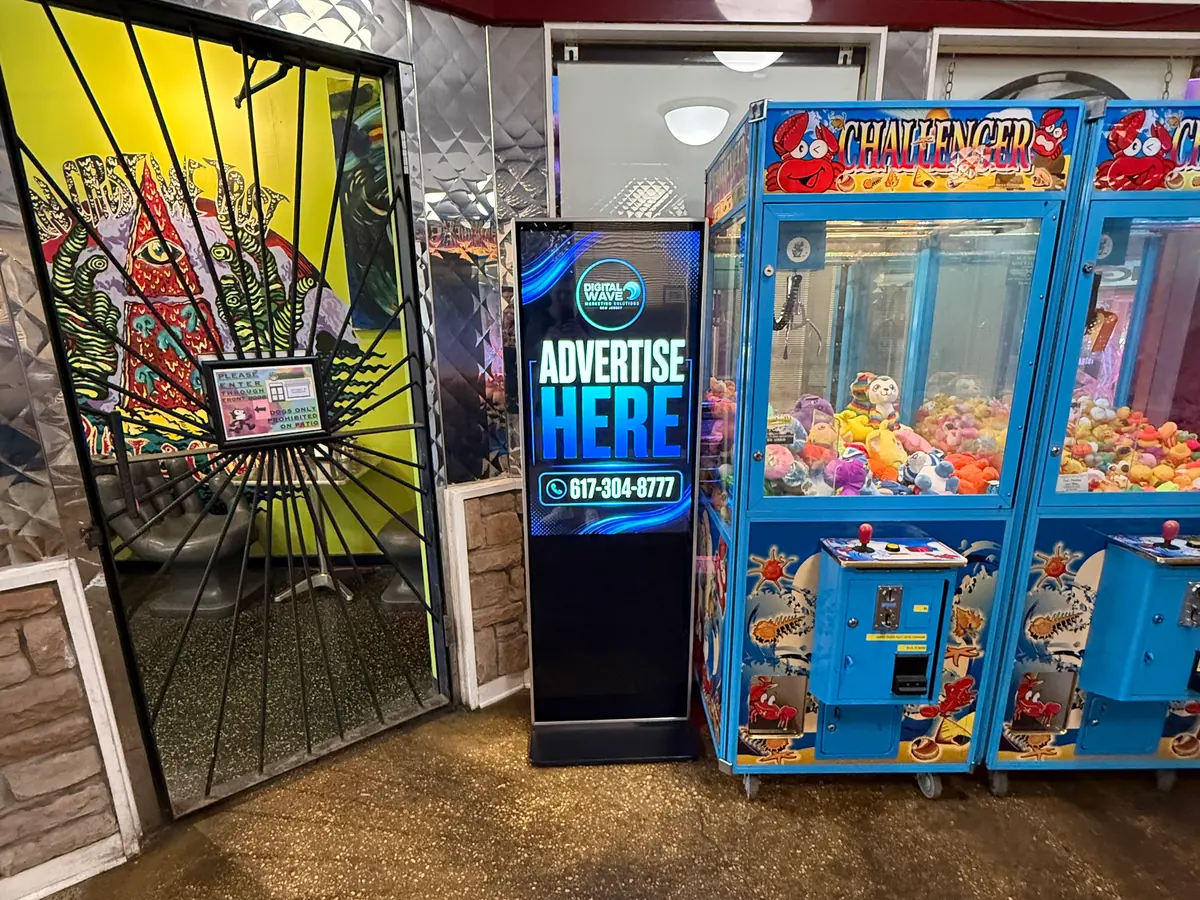 Digital Wave screen beside the game machines in a local pizzeria